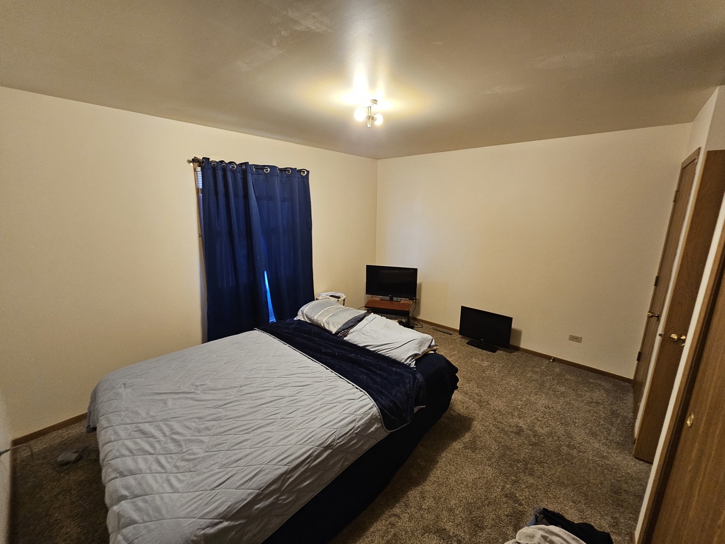 847-849 Rhodes Street Woodstock, IL 60098 - Photo 15 of 44 a bedroom with a bed and a dresser
