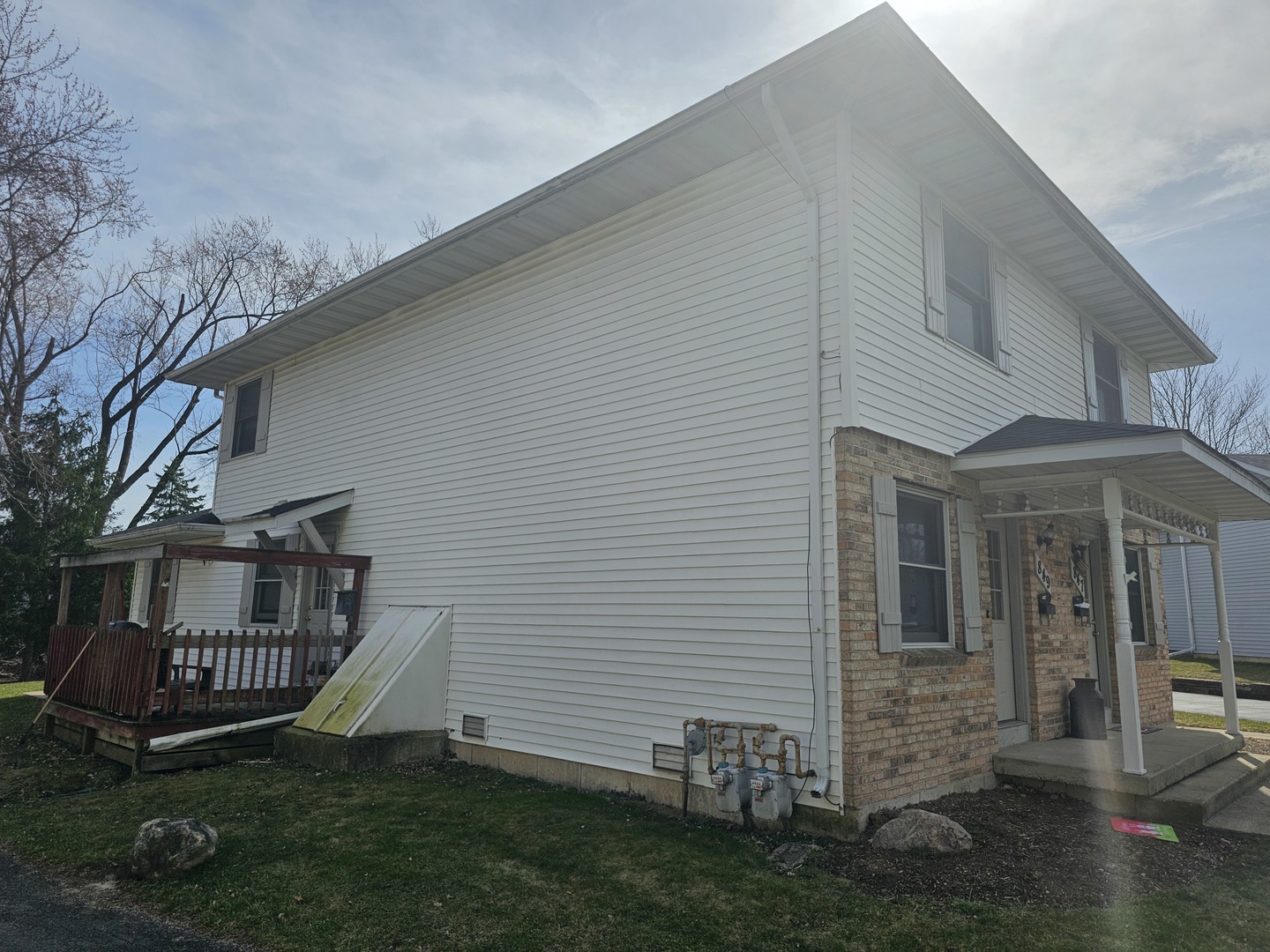 847-849 Rhodes Street Woodstock, IL 60098 - Photo 2 of 44 a view of a porch with a yard