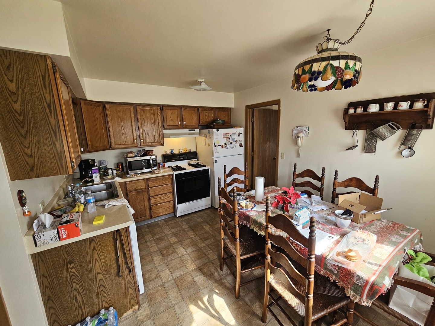 847-849 Rhodes Street Woodstock, IL 60098 - Photo 34 of 44 a kitchen with stainless steel appliances a stove a sink dishwasher and cabinets with wooden floor