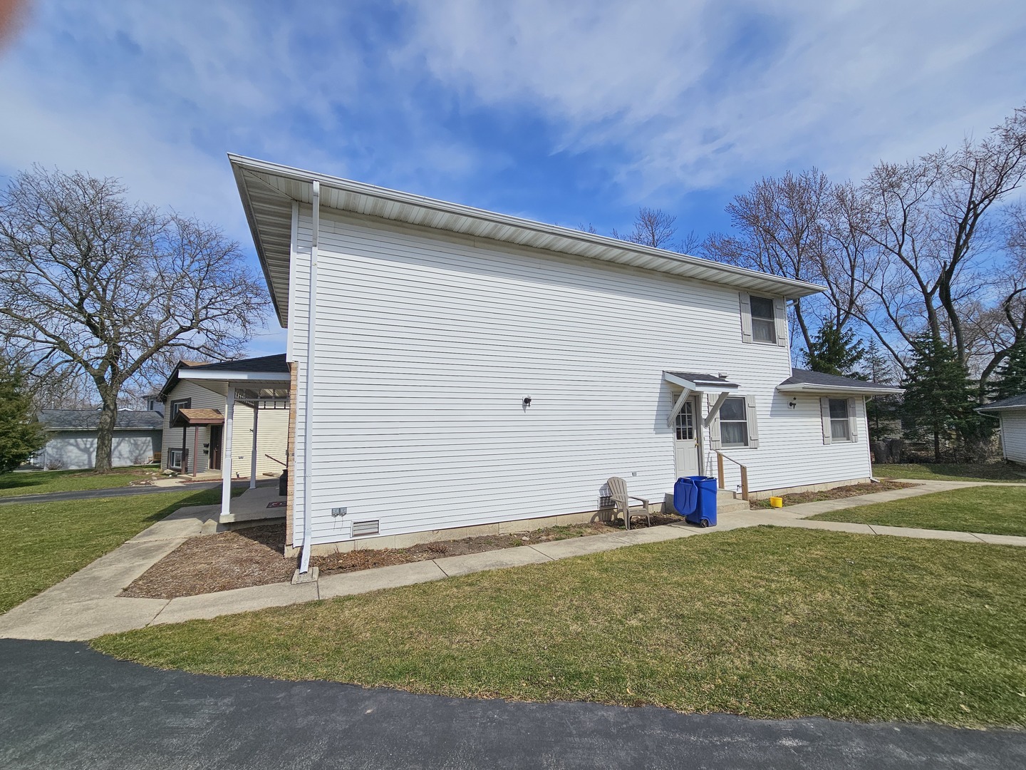 847-849 Rhodes Street Woodstock, IL 60098 - Photo 4 of 44 a view of a house with a yard