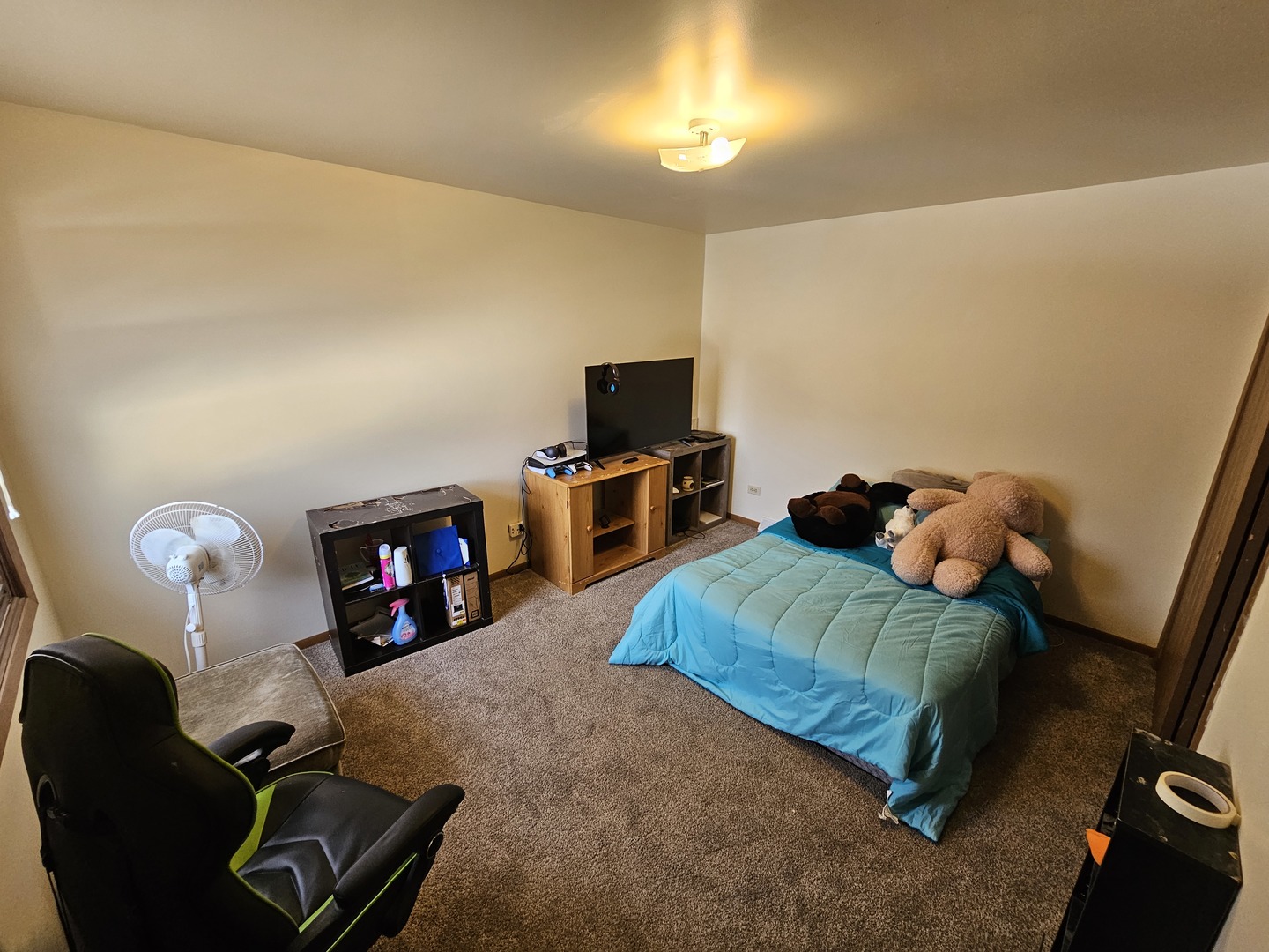847-849 Rhodes Street Woodstock, IL 60098 - Photo 42 of 44 a bedroom with furniture and a flat screen tv