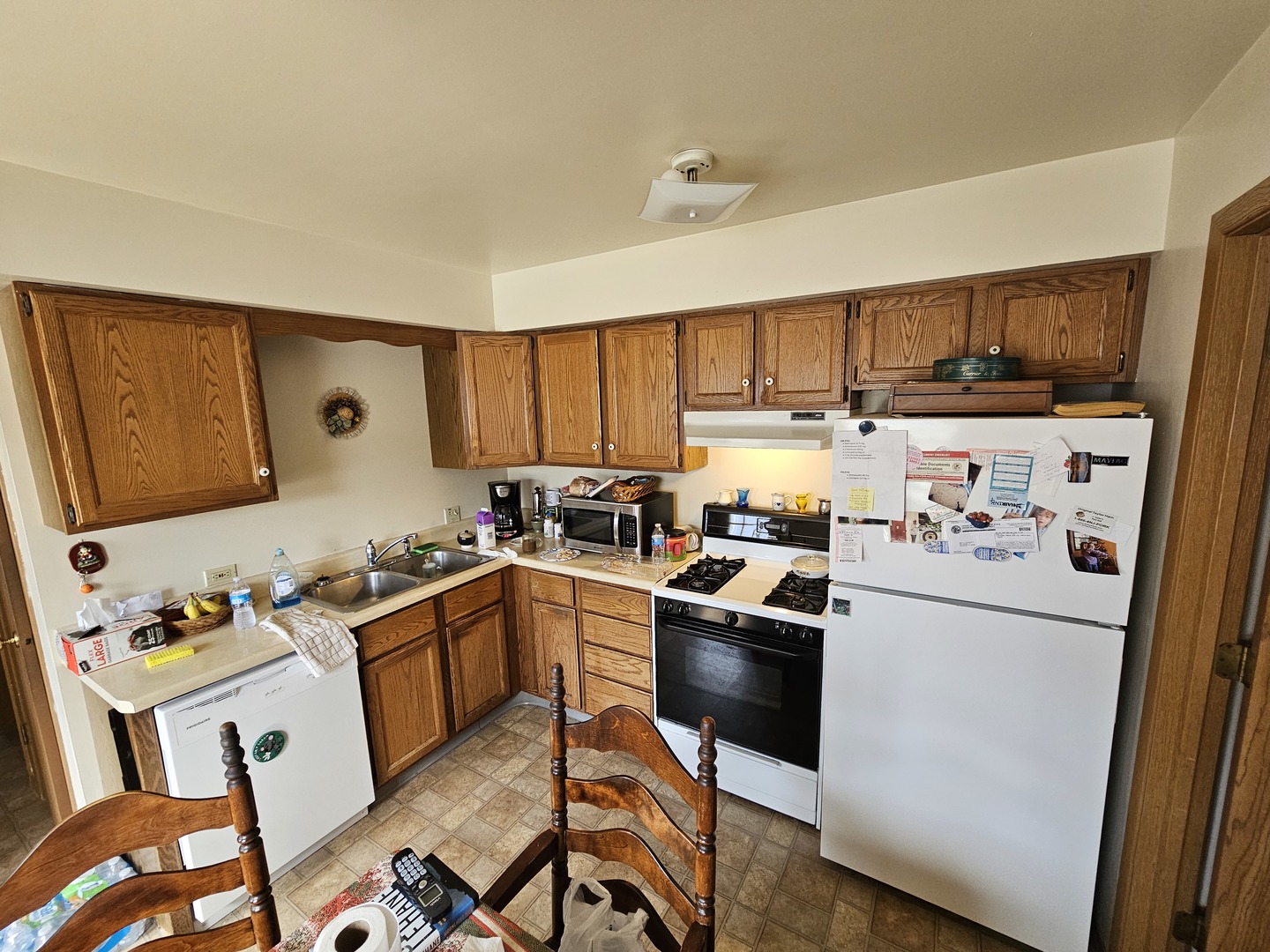 847-849 Rhodes Street Woodstock, IL 60098 - Photo 9 of 44 a kitchen with stainless steel appliances granite countertop a refrigerator and a stove top oven