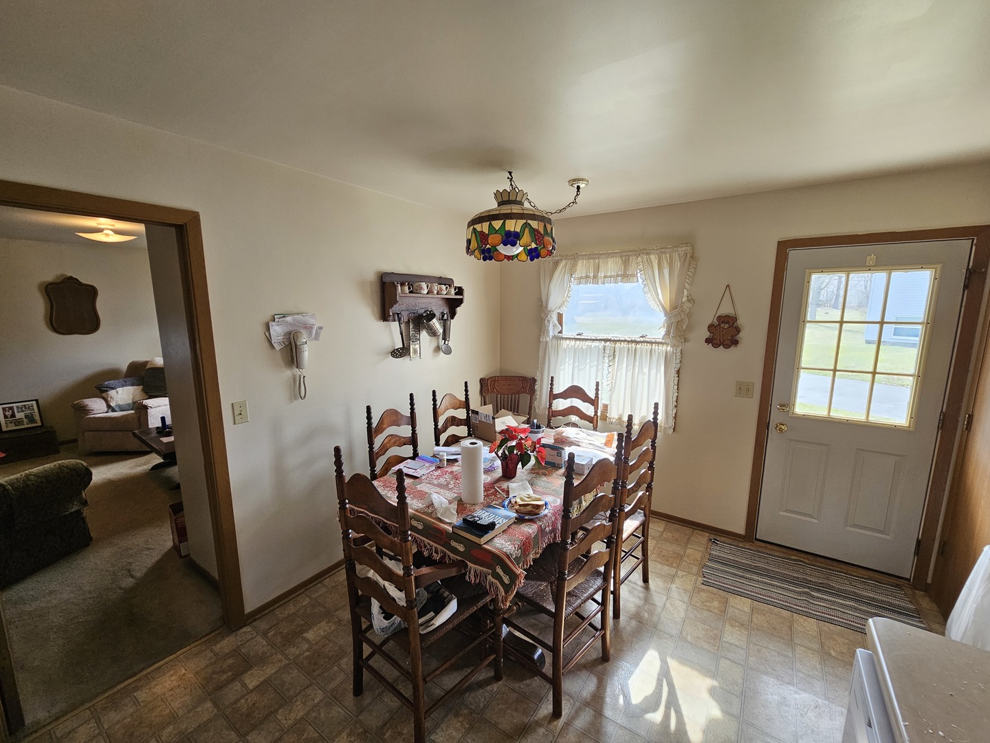 847-849 Rhodes Street Woodstock, IL 60098 - Photo 10 of 44 a view of a dining room with furniture and window