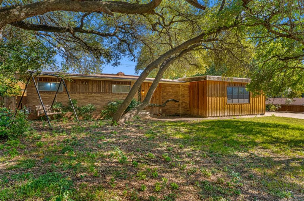 a backyard of a house with lots of green space