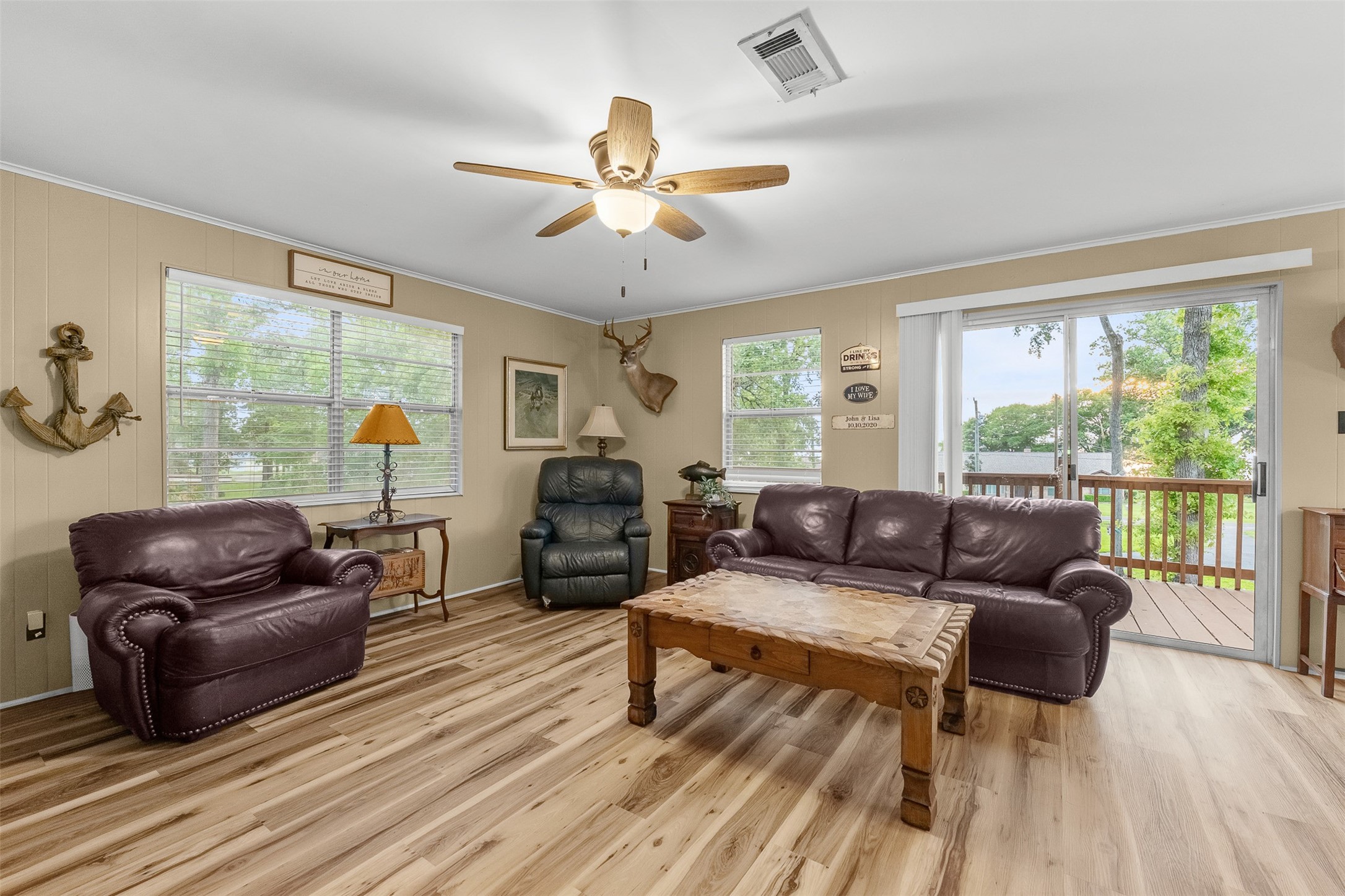 439 Lakeview Harbor Onalaska, TX 77360 - Photo 11 of 43 Behind the living area is a sliding door with a patio that overlooks Lake Livingston.