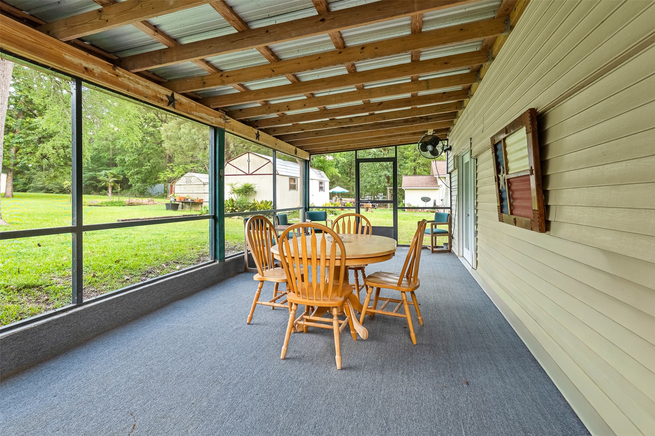 439 Lakeview Harbor Onalaska, TX 77360 - Photo 33 of 43 The screened in back porch provides a comfortable space to relax and gather, allowing you to enjoy the outdoors with ease and peace of mind.