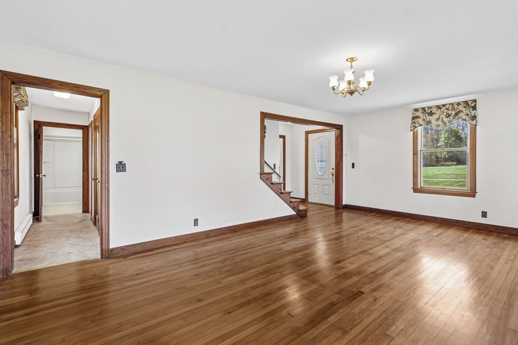 17 Moose Brook Road Southampton, MA 01073 - Photo 16 of 38 a view of an empty room with wooden floor and a window
