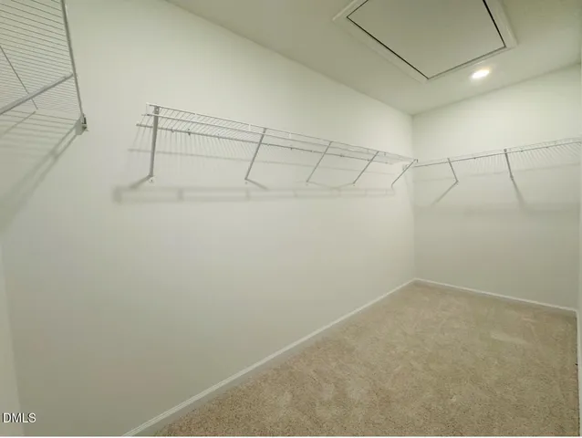 a view of a room with racks on the wall
