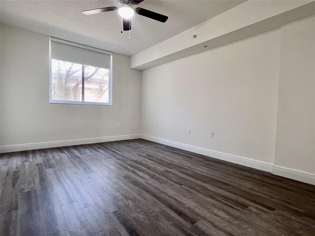 18335 Northwest 68th Avenue, Unit 245208 Hialeah, FL 33015 - Photo 6 of 18 wooden floor in an empty room with a window
