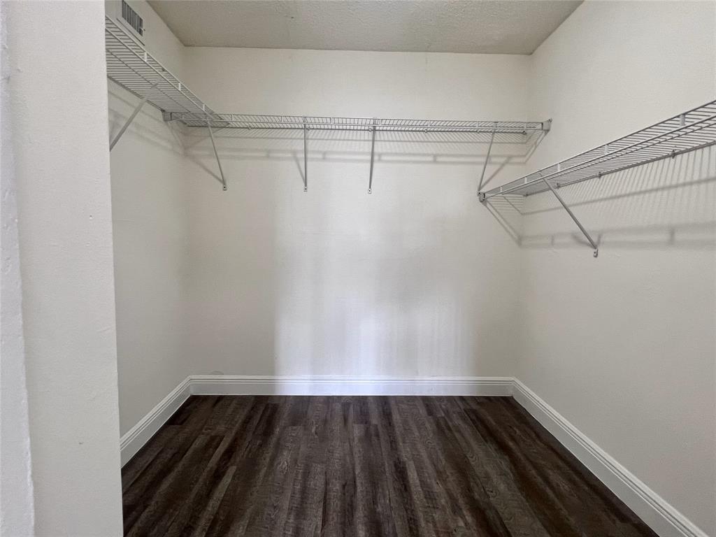 18335 Northwest 68th Avenue, Unit 245208 Hialeah, FL 33015 - Photo 10 of 18 a view of a room with racks on the wall