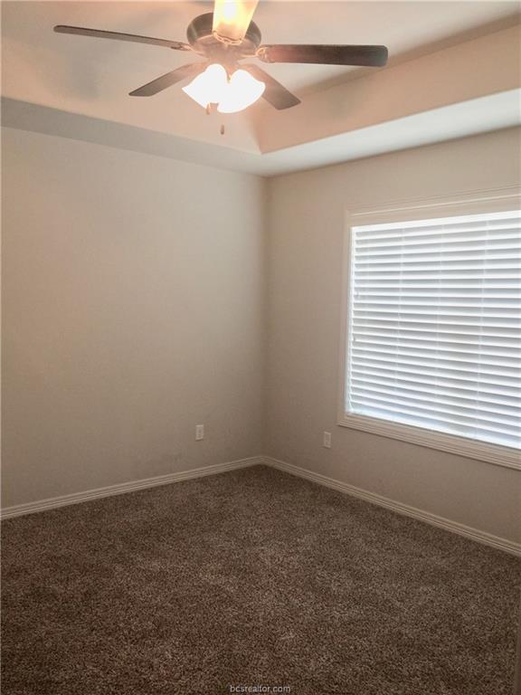 109 Ehlinger Drive Bryan, TX 77801 - Photo 7 of 25 an empty room with a window and a fan