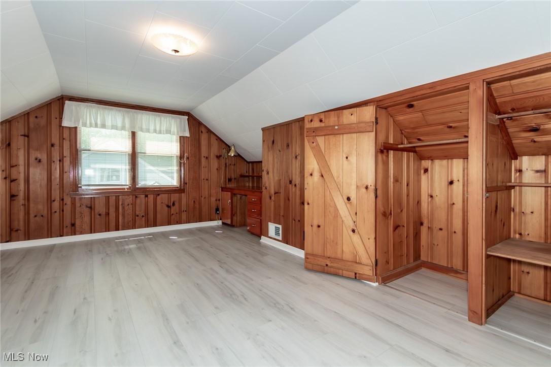 5223 Edenhurst Road Cleveland, OH 44124 - Photo 32 of 50 Bonus room with wood finished floors, lofted ceiling, and wooden walls