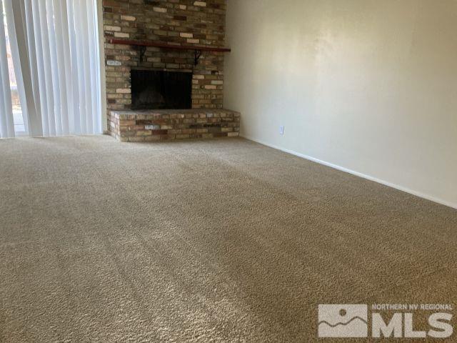 3240 Gypsum Road Reno, NV 89503 - Photo 7 of 14 a view of an empty room and fire place