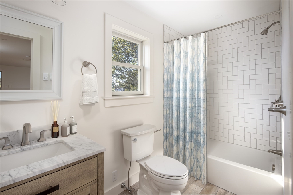 8 Channel Street Mattapoisett, MA 02739 - Photo 13 of 39 a bathroom with a granite countertop sink toilet and shower