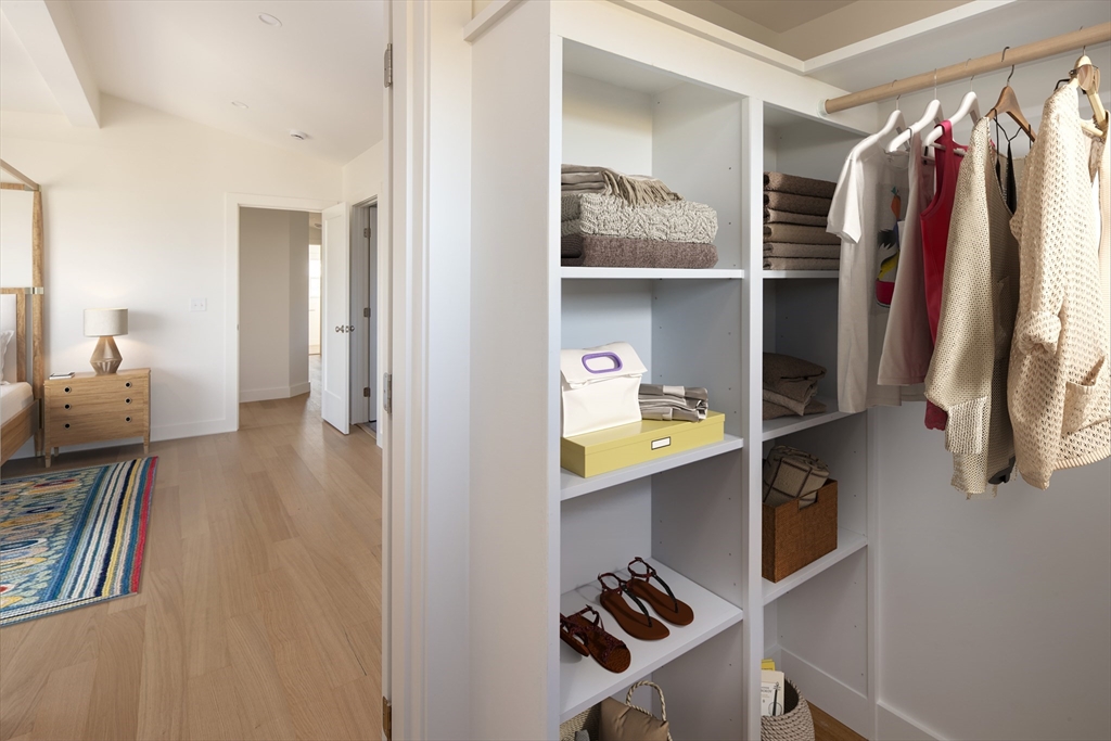 8 Channel Street Mattapoisett, MA 02739 - Photo 22 of 39 a view of walk in closet with clothes and shoes