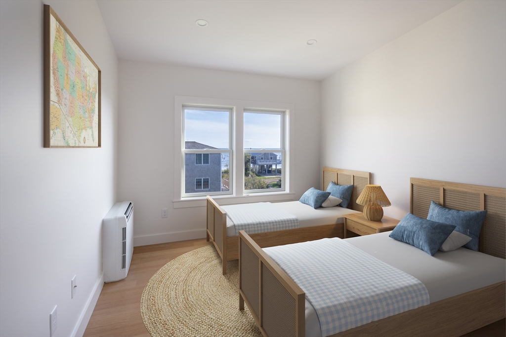 8 Channel Street Mattapoisett, MA 02739 - Photo 23 of 39 a bedroom with two beds and a large window