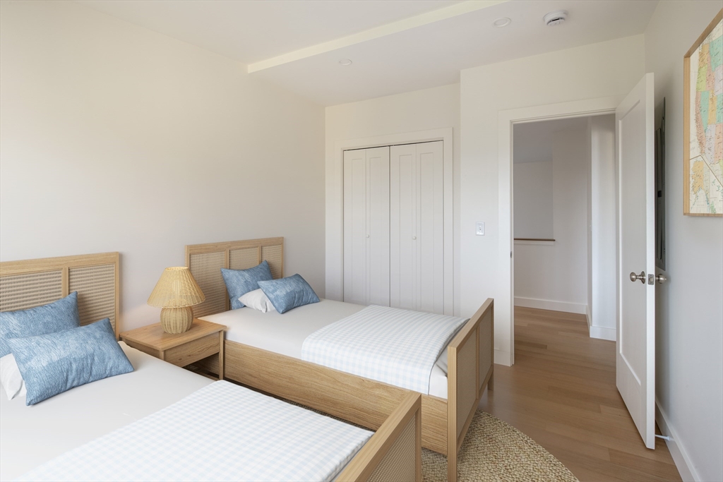 8 Channel Street Mattapoisett, MA 02739 - Photo 24 of 39 a bedroom with a bed and a lamp