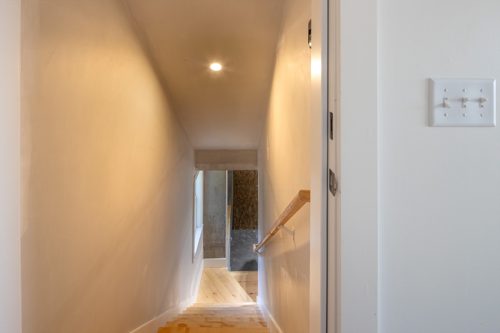 8 Channel Street Mattapoisett, MA 02739 - Photo 28 of 39 a view of a hallway with wooden floor and entryway