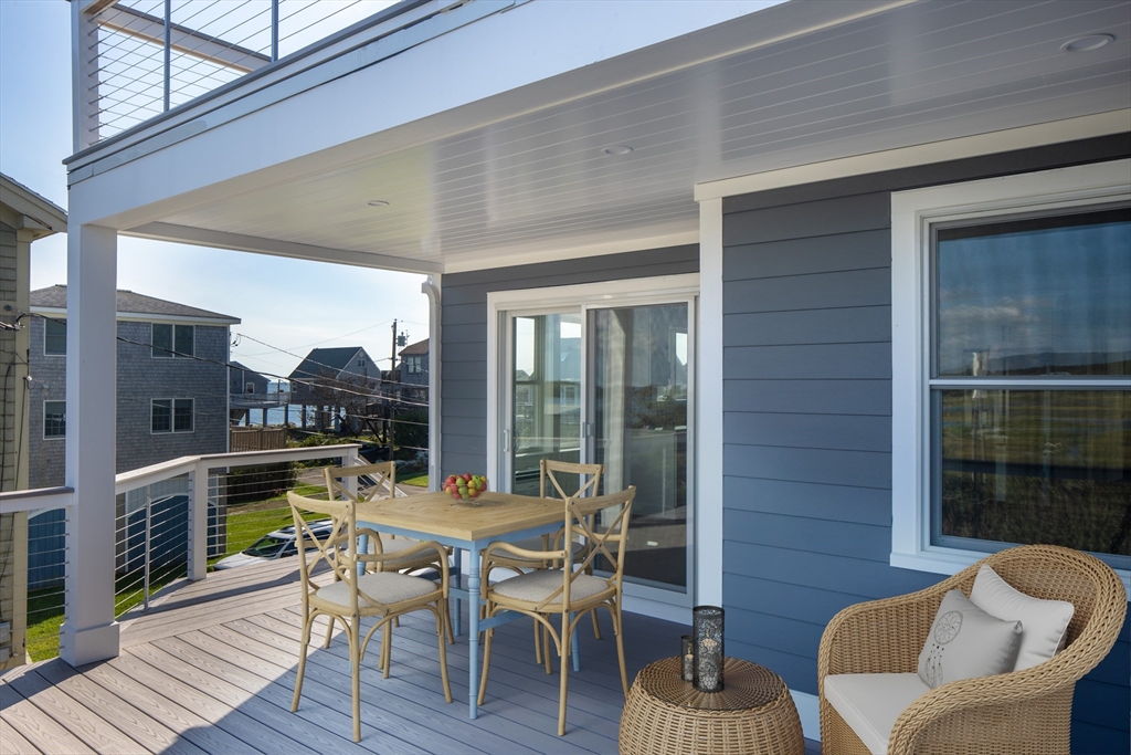 8 Channel Street Mattapoisett, MA 02739 - Photo 9 of 39 a view of a dining room with furniture window and wooden floor