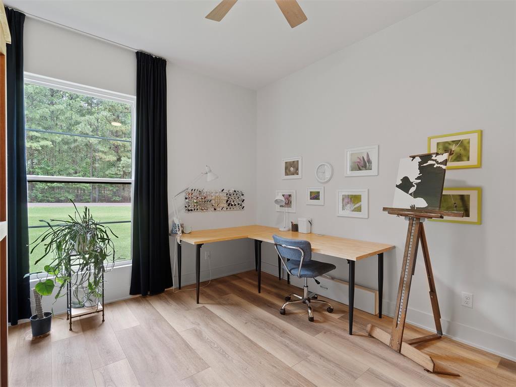 800 John Dean Road Gilmer, TX 75644 - Photo 32 of 40 a view of a workspace with furniture and a window