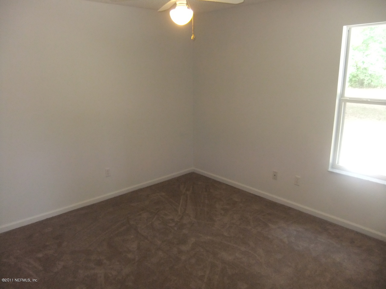 56101 Griffin Road Callahan, FL 32011 - Photo 14 of 18 a room that has a window in it
