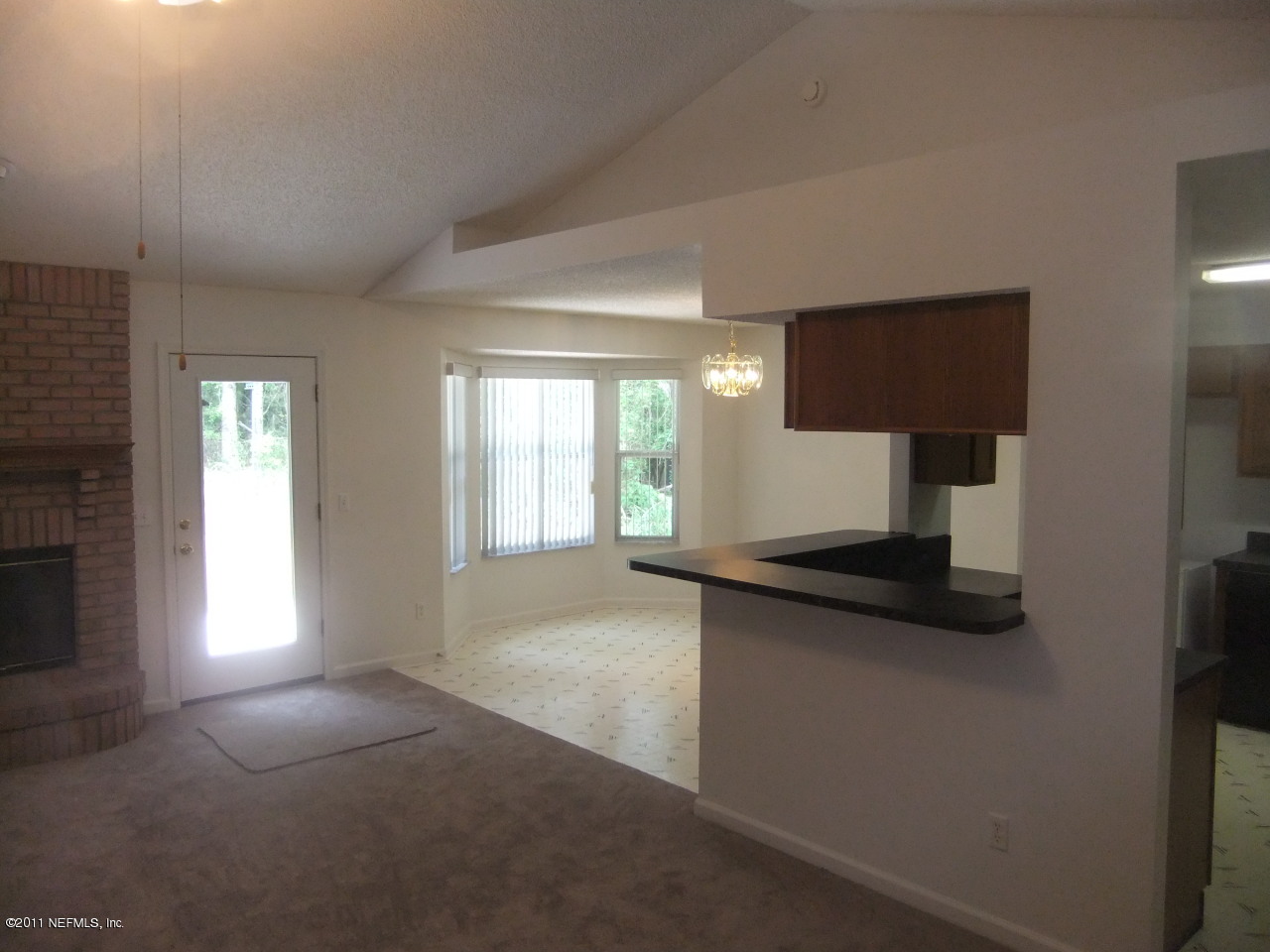 56101 Griffin Road Callahan, FL 32011 - Photo 9 of 18 a kitchen with a sink and a window