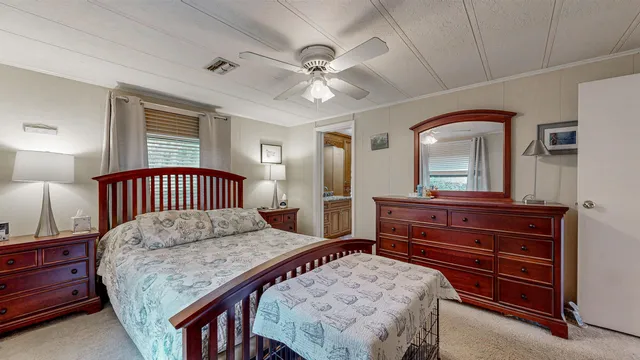 a bedroom with a bed and a dresser