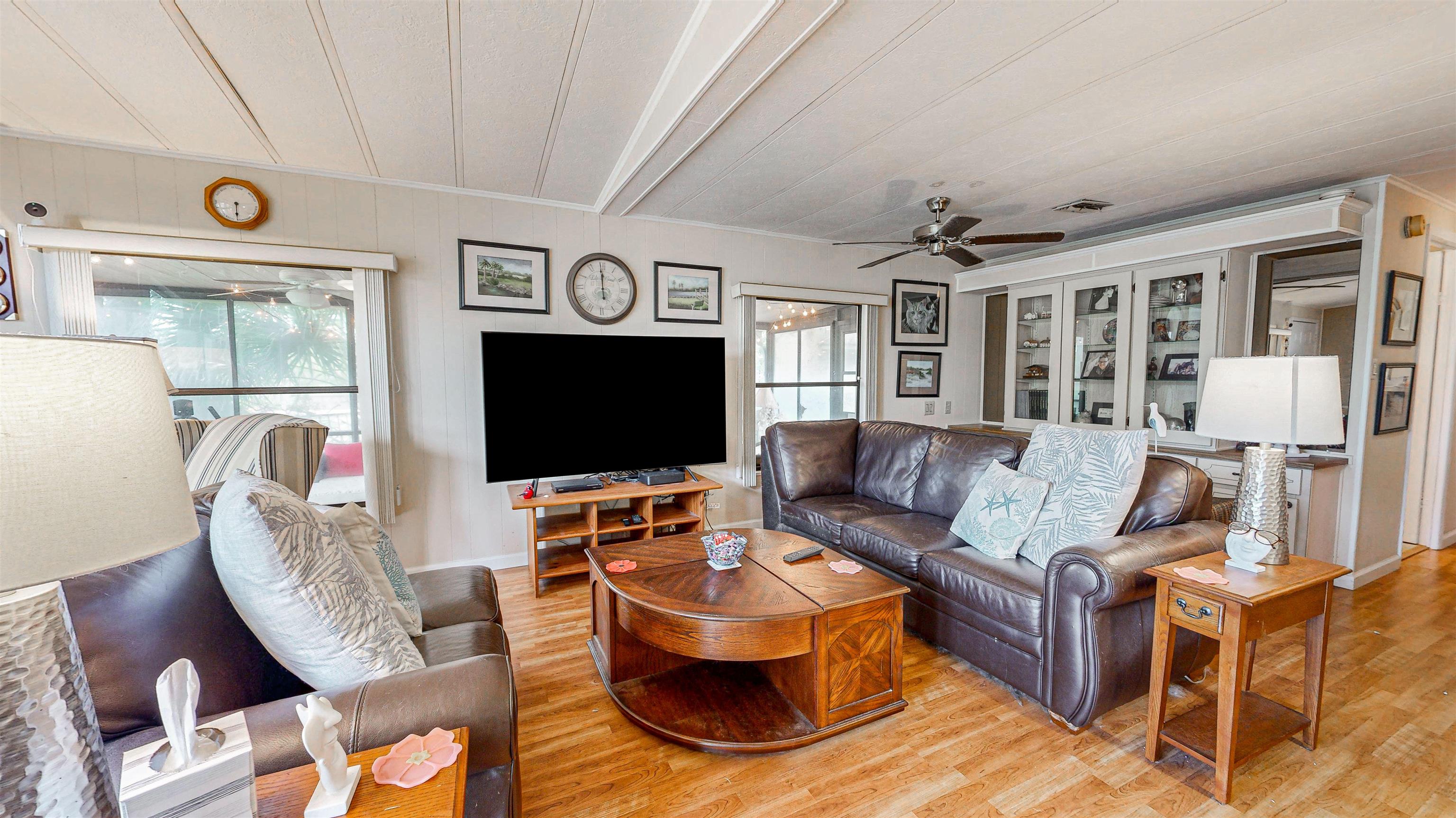 224 Puebla Road St. Augustine, FL 32080 - Photo 5 of 32 a living room with furniture and a flat screen tv