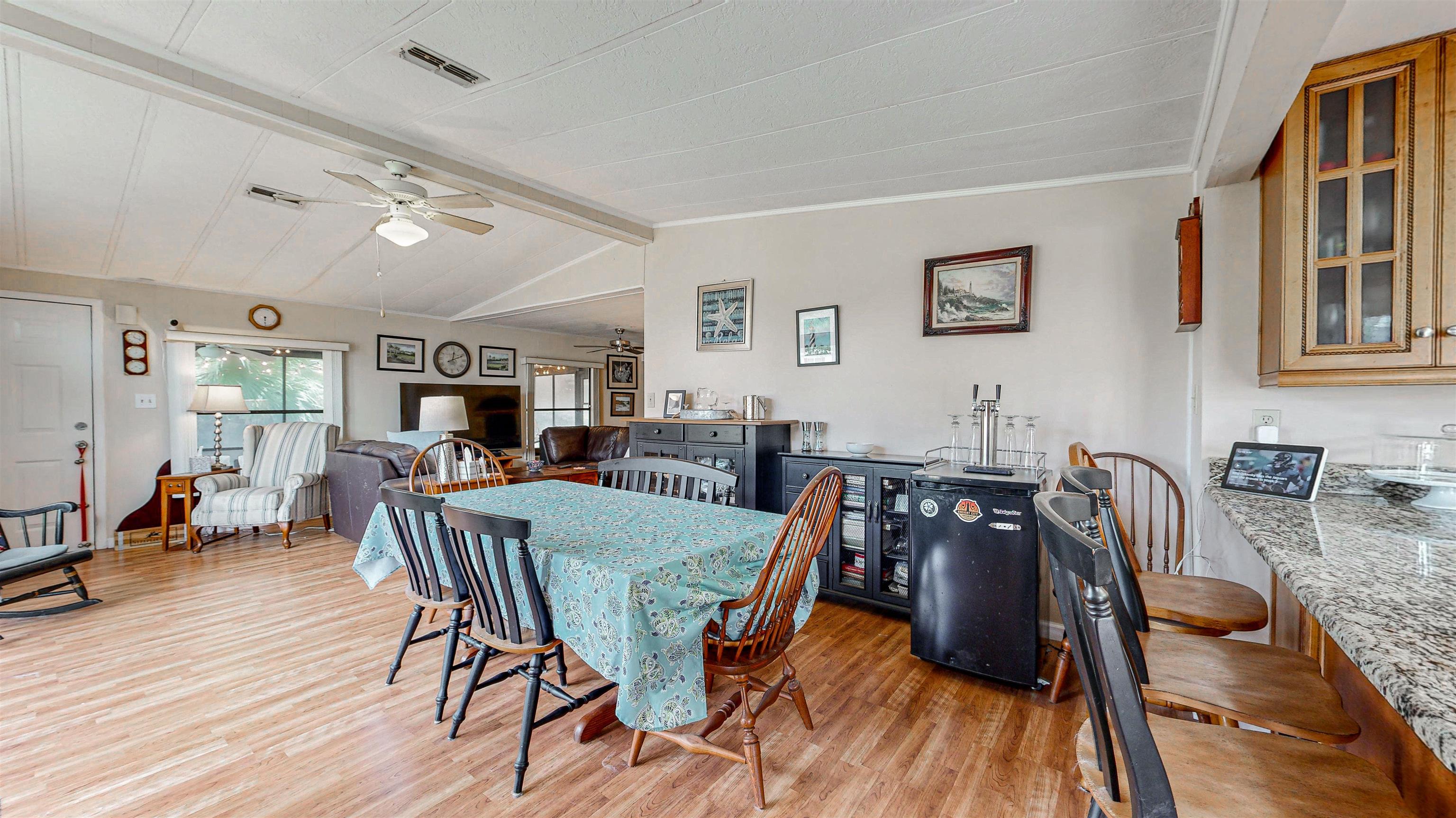 224 Puebla Road St. Augustine, FL 32080 - Photo 8 of 32 a view of a dining room with furniture and wooden floor
