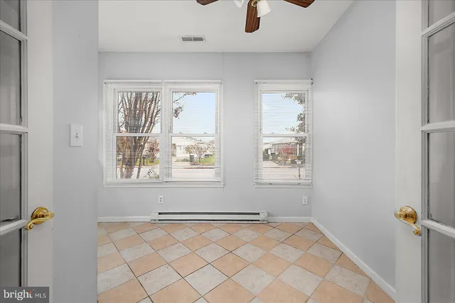 a view of an empty room with a window