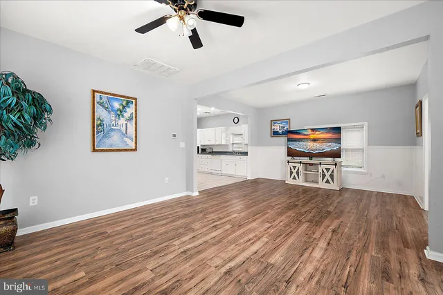 a room with furniture and a wooden floor