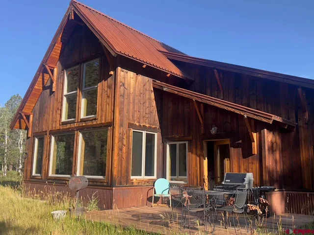 a view of a lake and outdoor seating