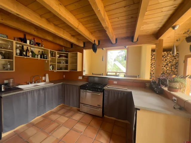 a kitchen with stainless steel appliances granite countertop a sink and cabinets