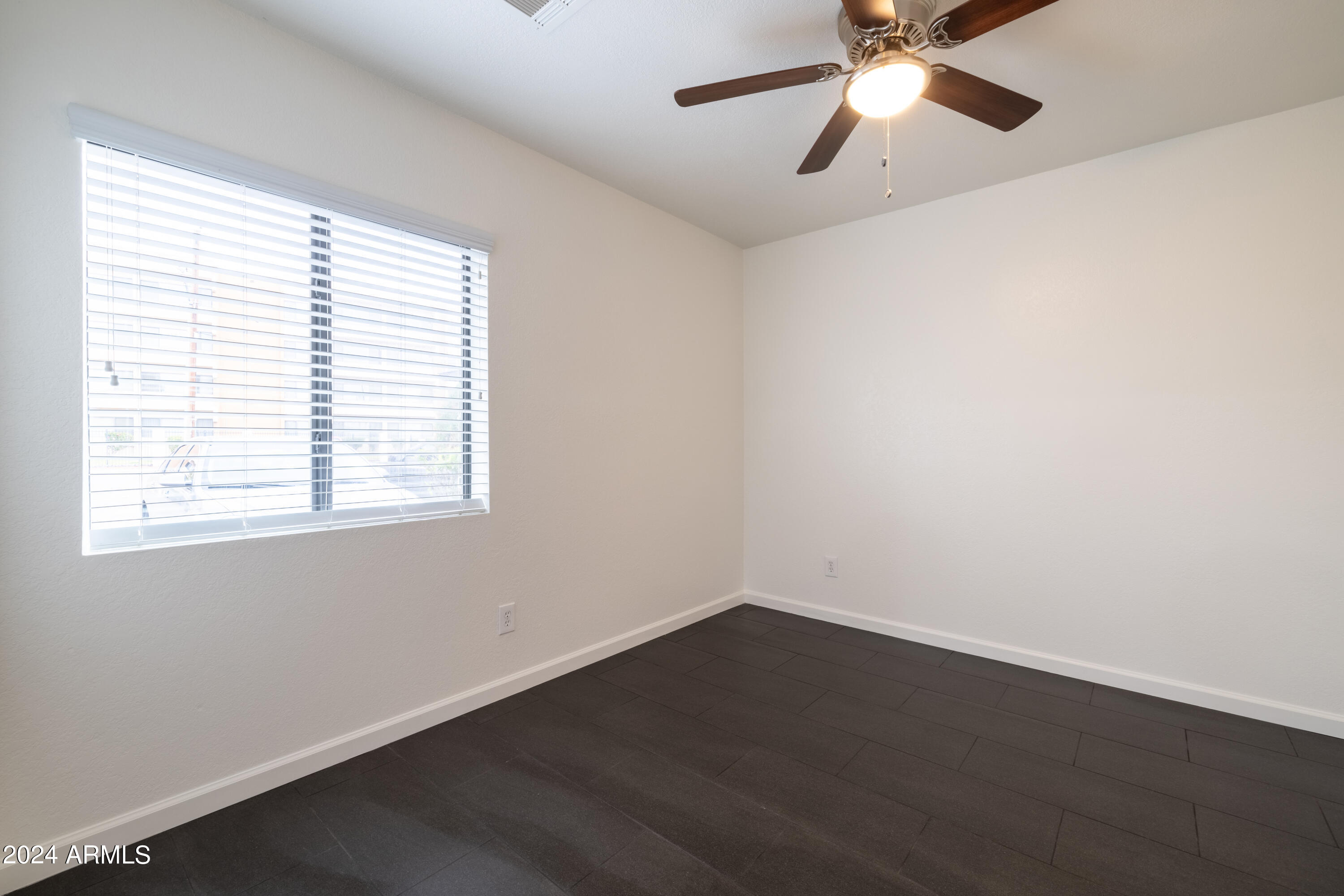 3034 North 35th Street Phoenix, AZ 85018 - Photo 15 of 37 wooden floor in an empty room with a window