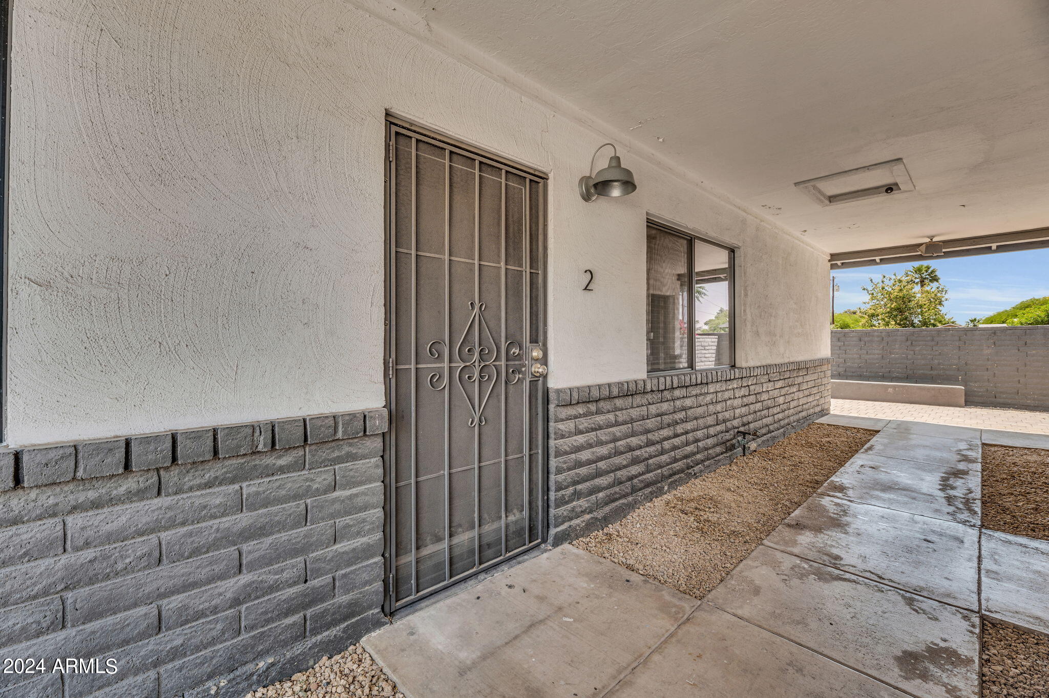 3034 North 35th Street Phoenix, AZ 85018 - Photo 16 of 37 a view of a porch with wooden floor and windows