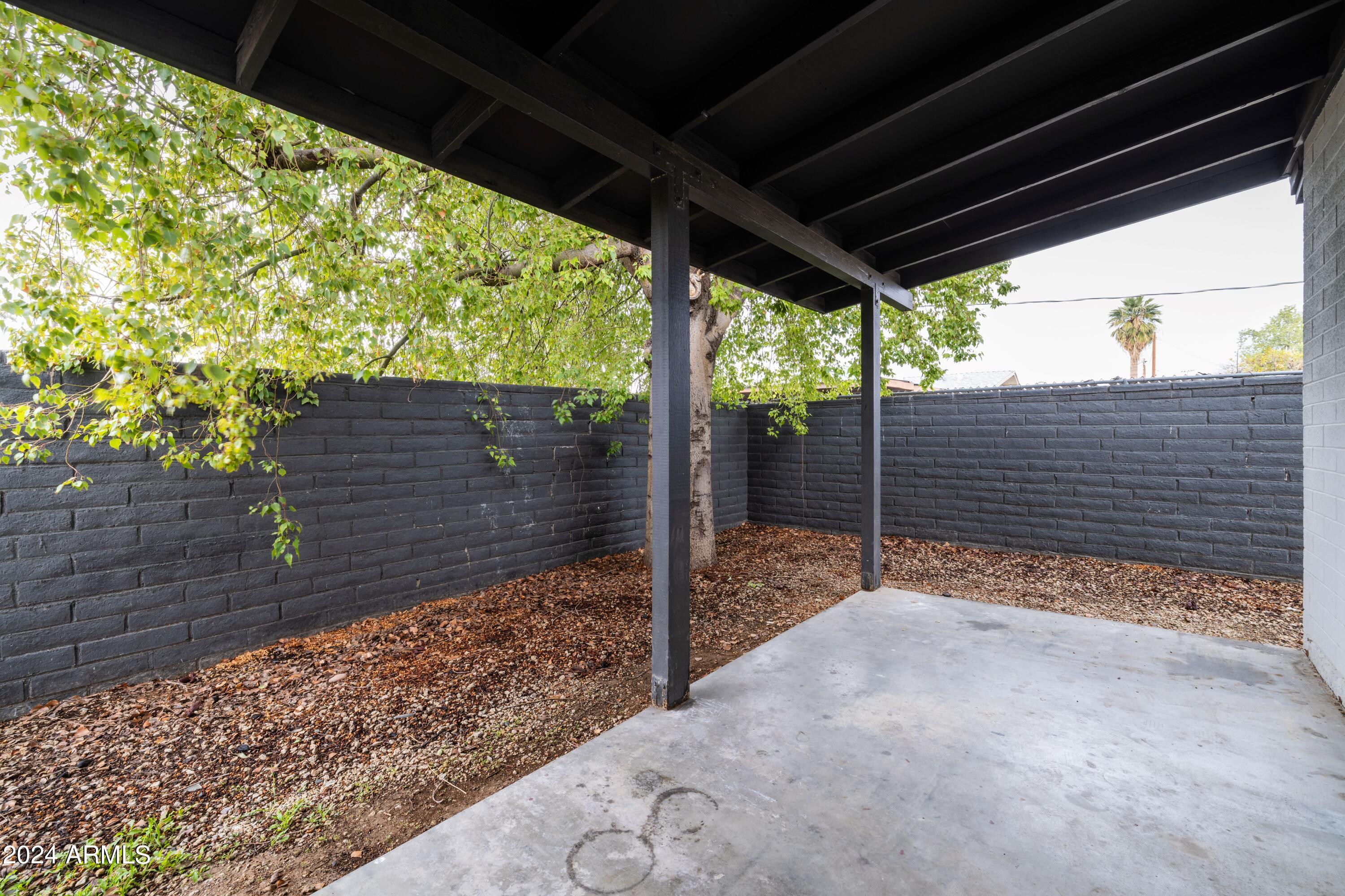 3034 North 35th Street Phoenix, AZ 85018 - Photo 24 of 37 a view of a backyard with wooden fence