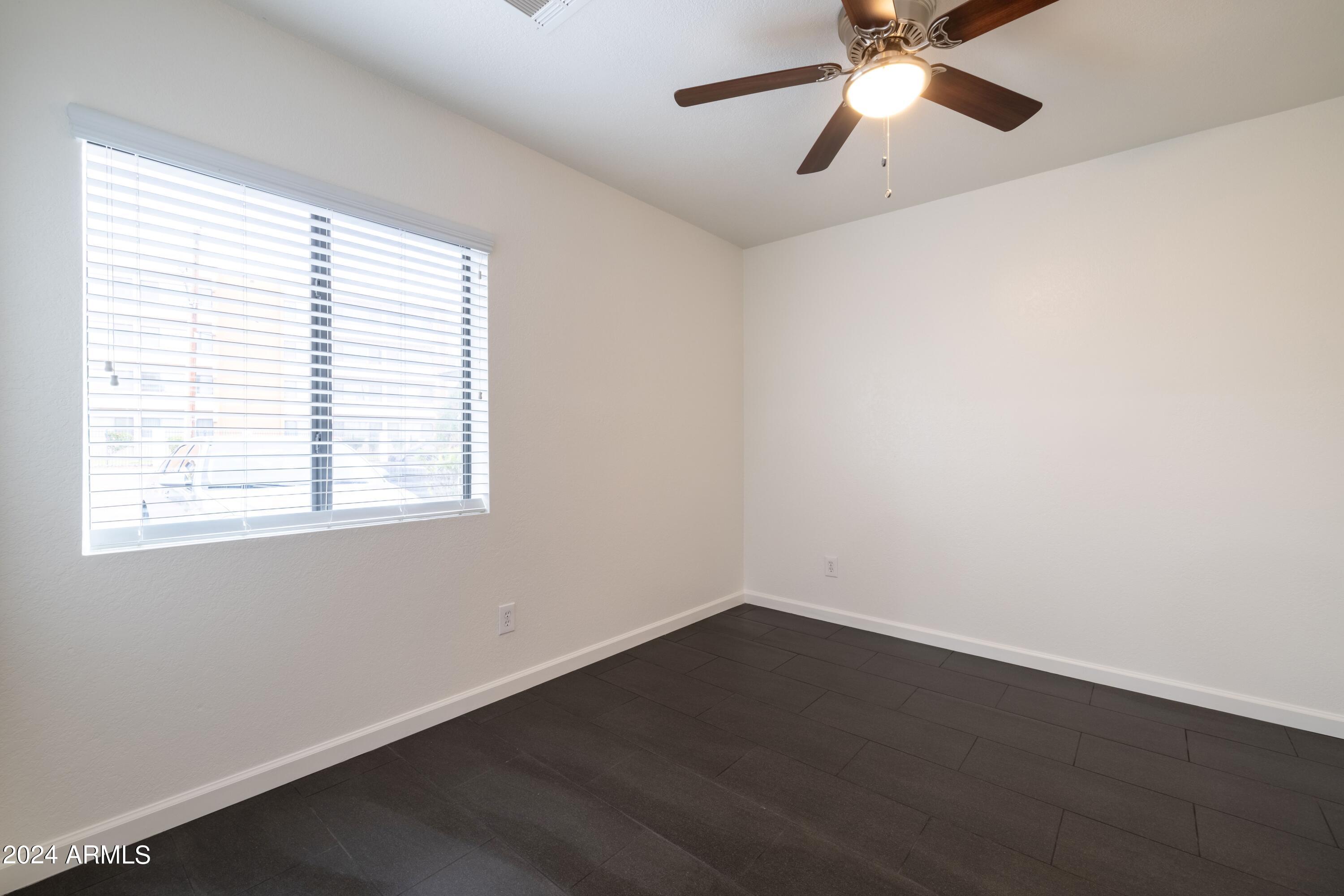 3034 North 35th Street Phoenix, AZ 85018 - Photo 29 of 37 wooden floor in an empty room with a window
