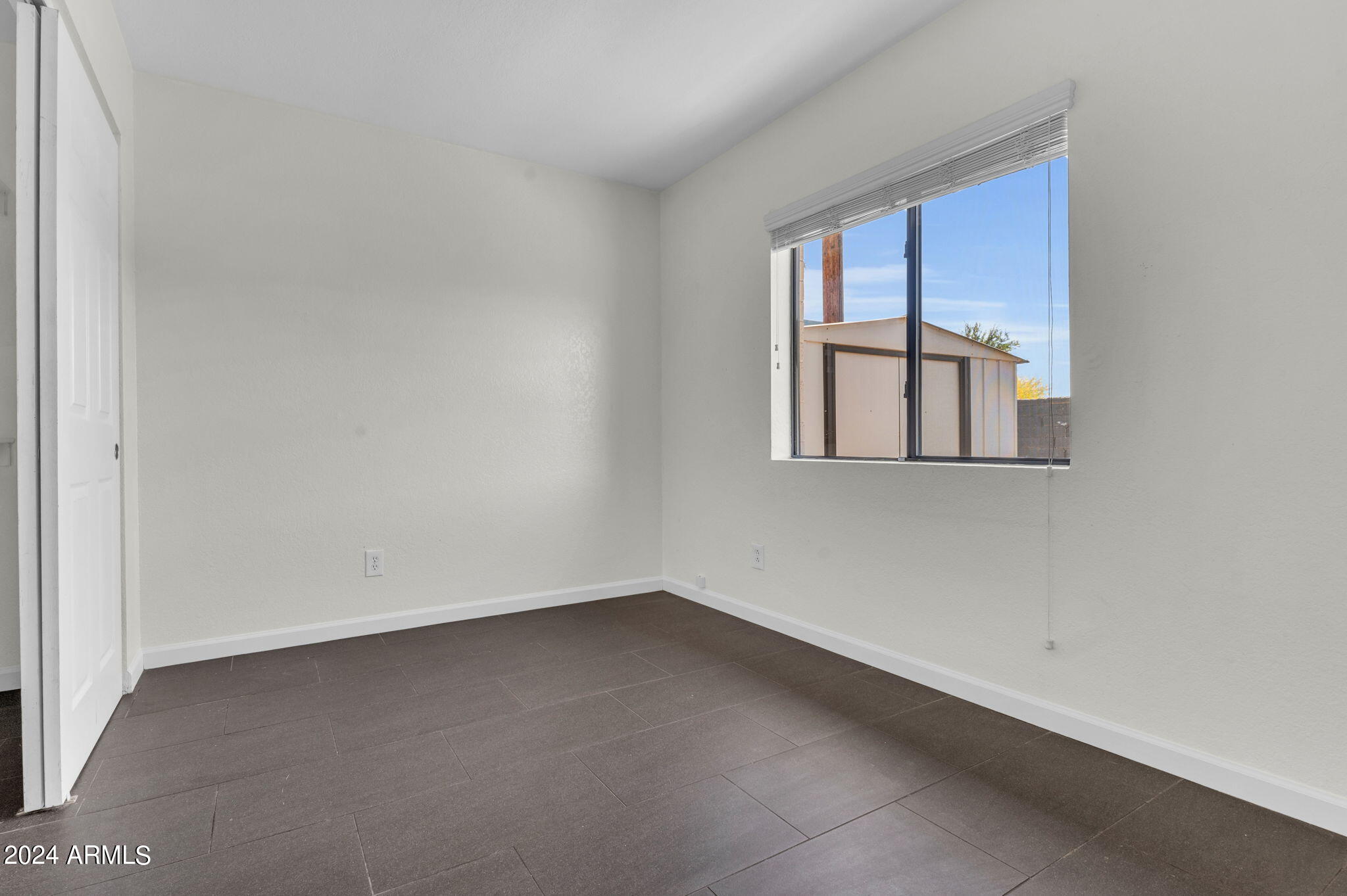 3034 North 35th Street Phoenix, AZ 85018 - Photo 10 of 37 an empty room with a window