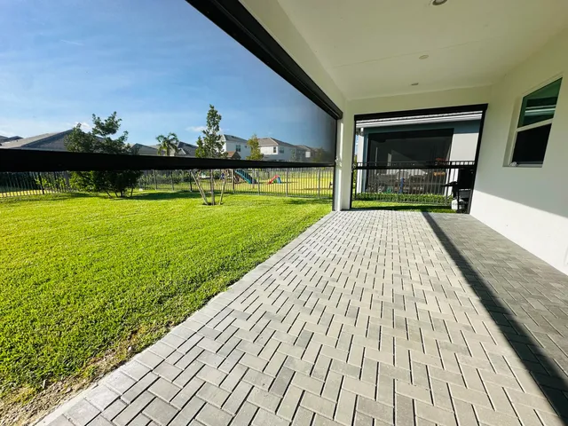 a view of swimming pool with a patio