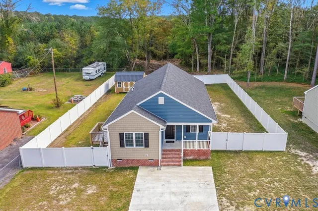 a aerial view of a house with a yard