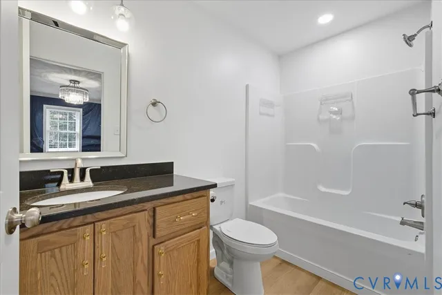 a view of a wooden deck with a yard