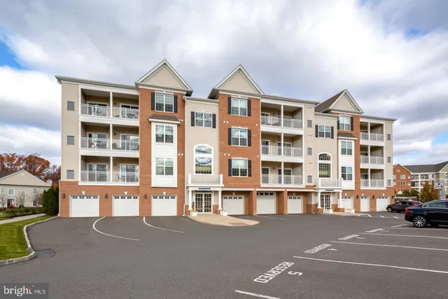a front view of a building with a street
