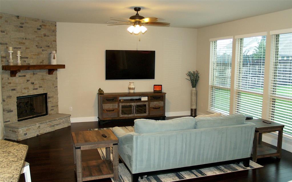 2104 Vista Ridge Road Melissa, TX 75454 - Photo 14 of 40 a living room with furniture and a flat screen tv