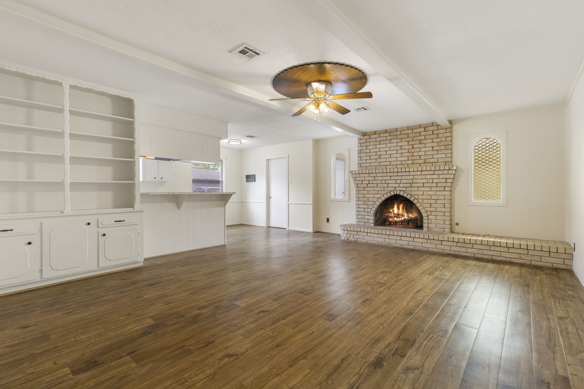 519 Kathy Street Humble, TX 77338 - Photo 5 of 21 The cozy fireplace makes the family room very inviting, while the built-in book case adds extra storage!