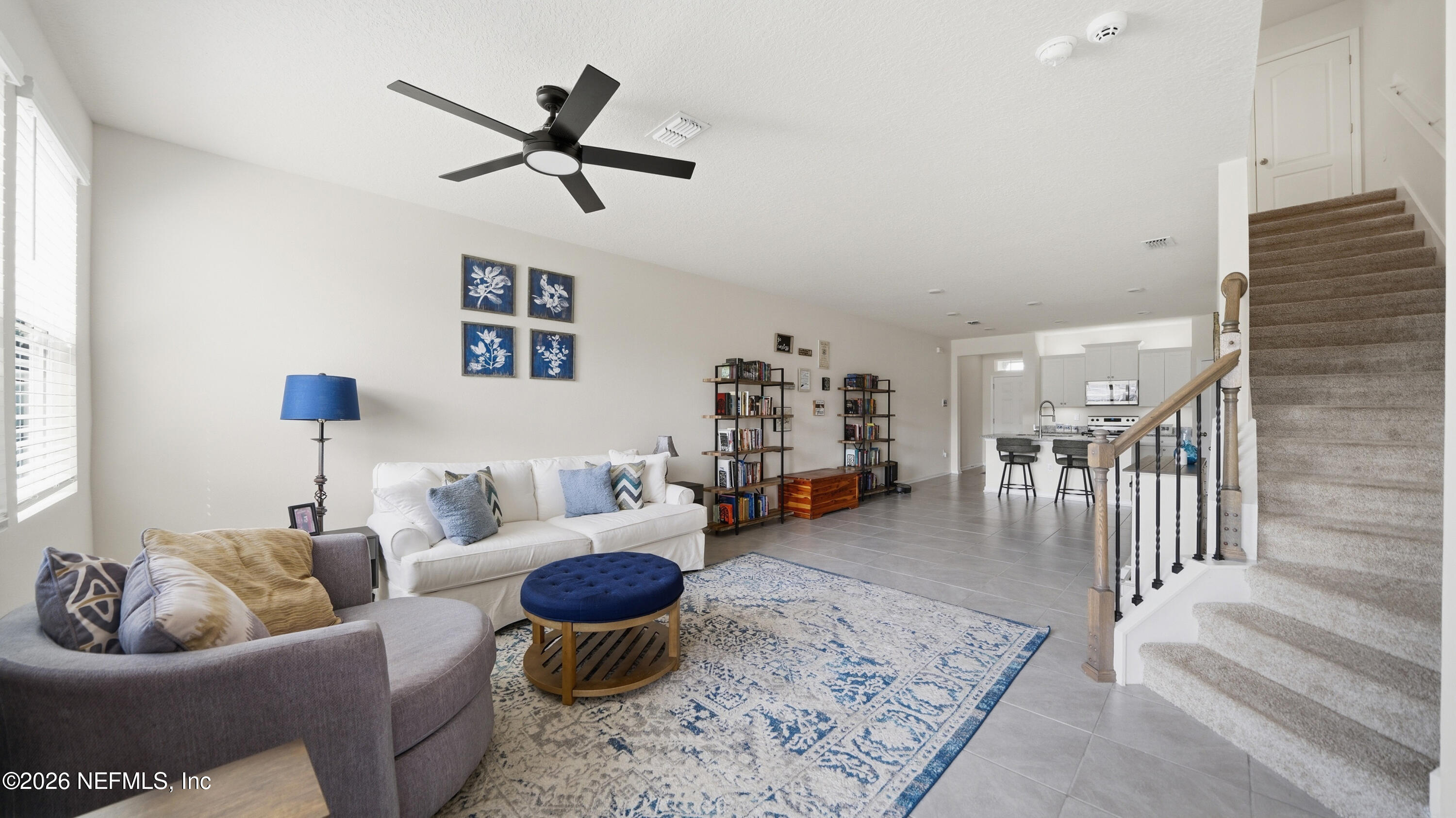 172 Redbud Road Palm Coast, FL 32137 - Photo 13 of 43 a living room with furniture and a rug