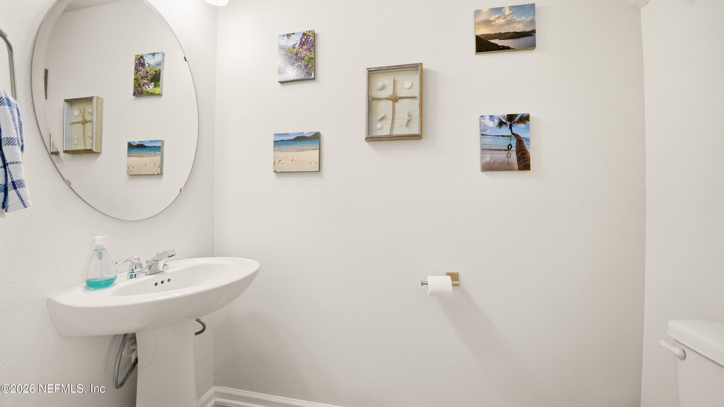 172 Redbud Road Palm Coast, FL 32137 - Photo 14 of 43 a bathroom with a sink a mirror and vanity