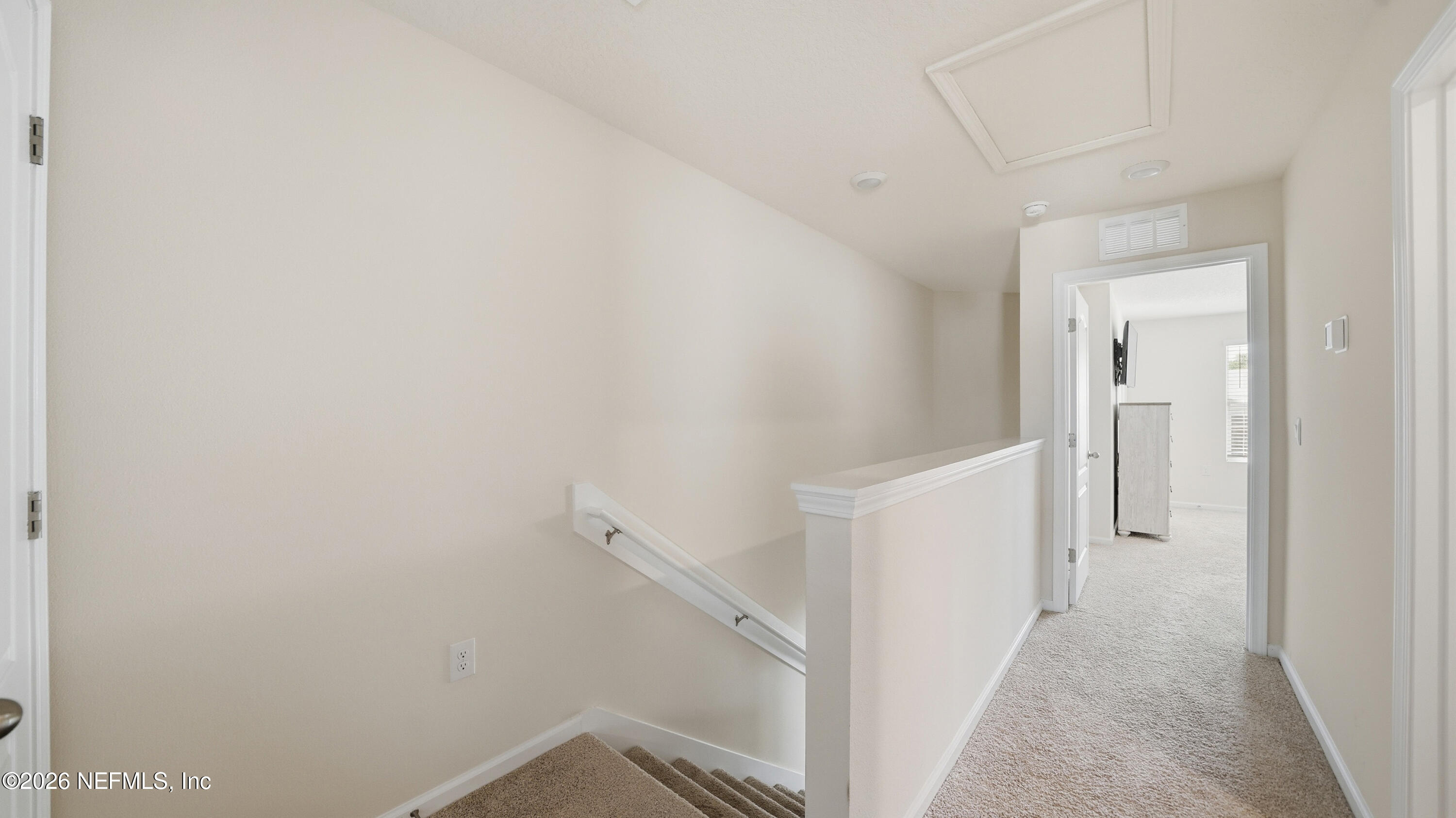 172 Redbud Road Palm Coast, FL 32137 - Photo 18 of 43 a view of a hallway with white walls