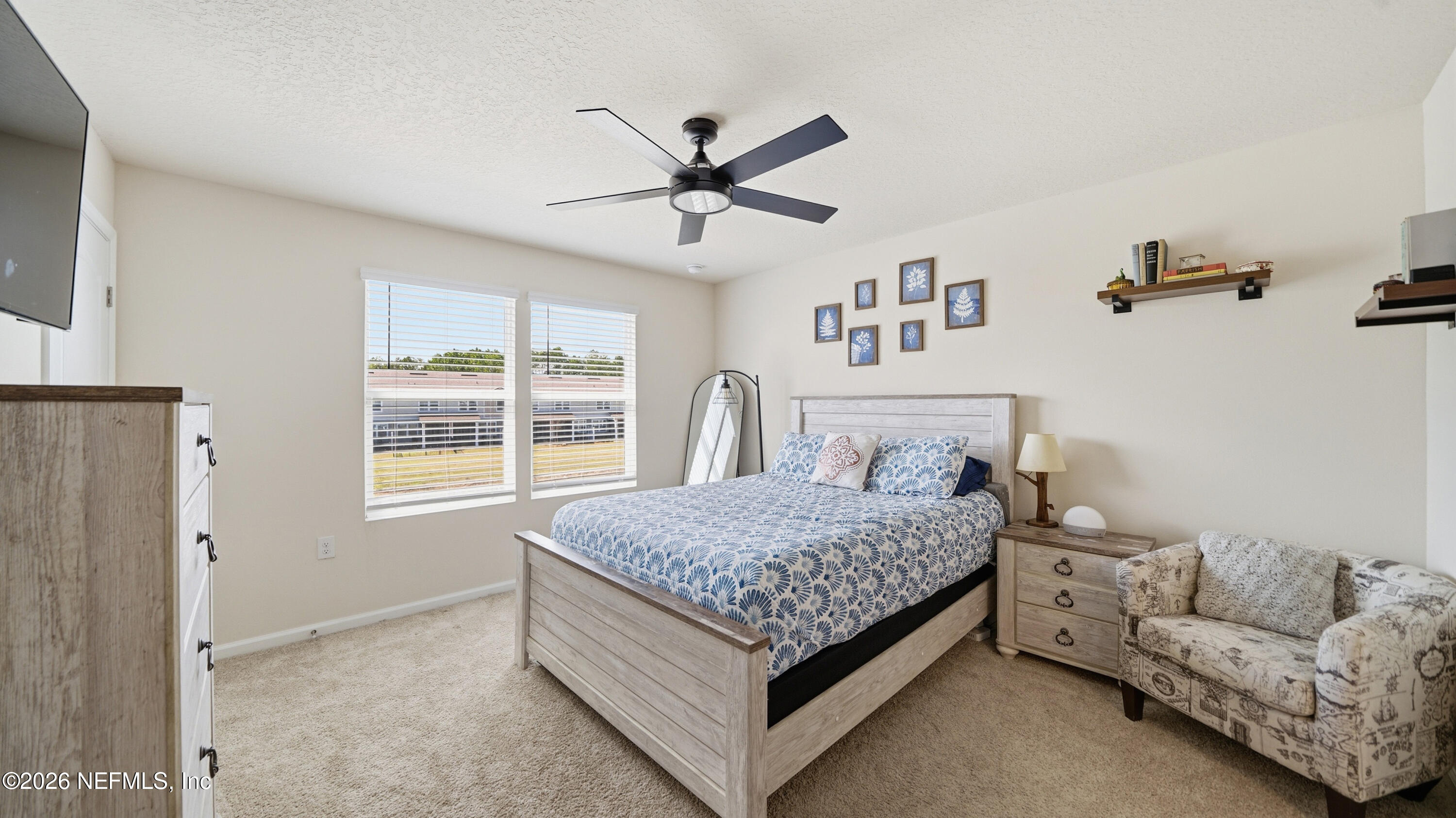 172 Redbud Road Palm Coast, FL 32137 - Photo 19 of 43 a bed room with a bed and a window