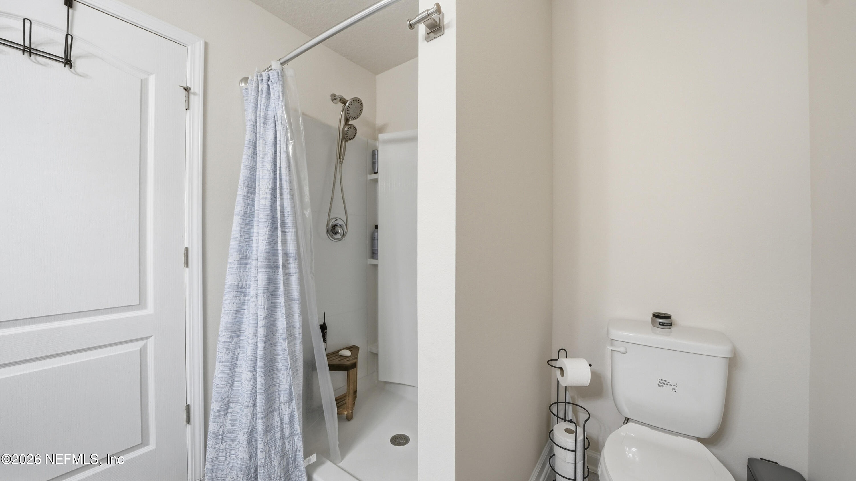172 Redbud Road Palm Coast, FL 32137 - Photo 24 of 43 a bathroom with a shower and a toilet