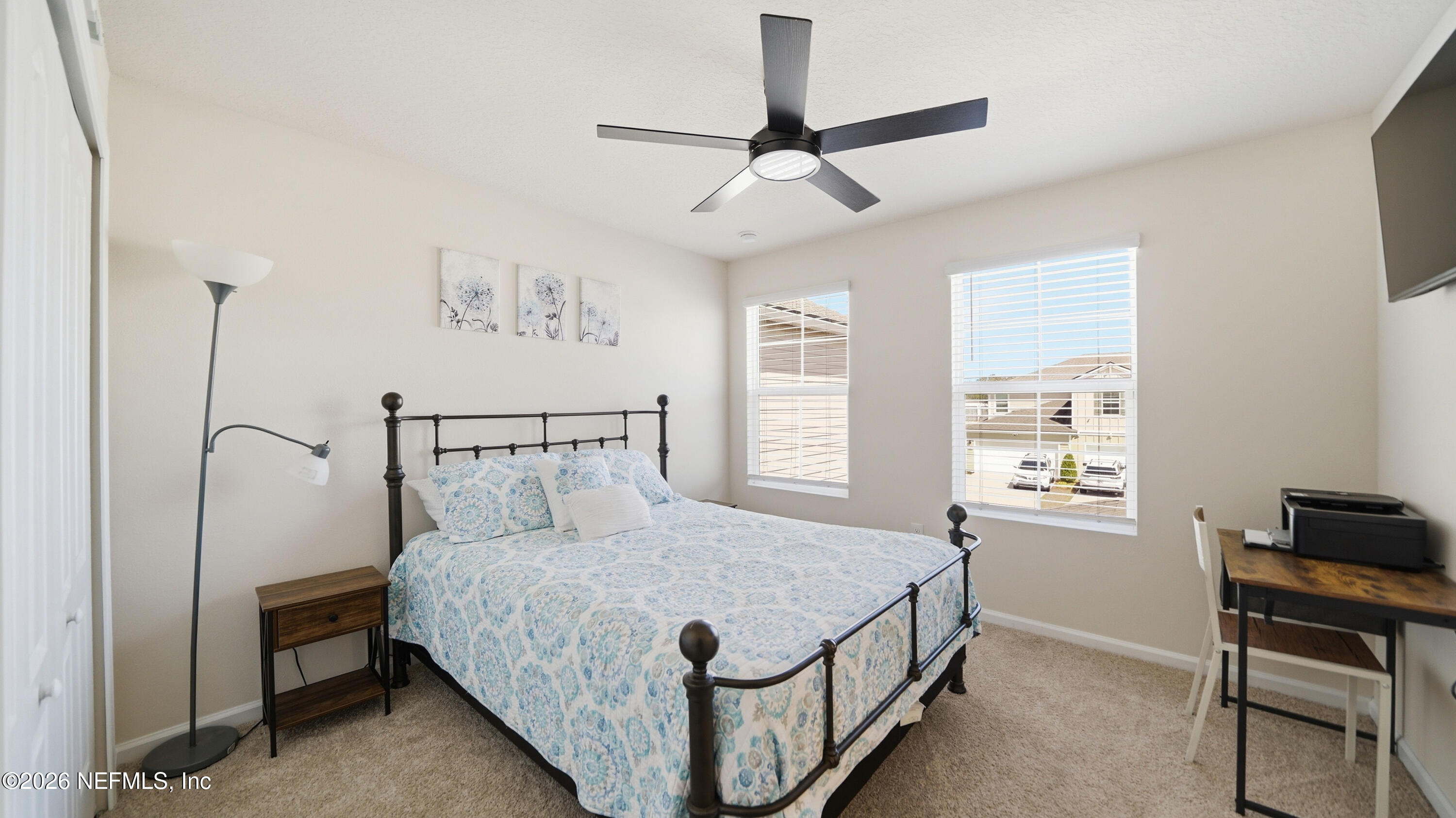 172 Redbud Road Palm Coast, FL 32137 - Photo 26 of 43 a bed room with a bed and a window